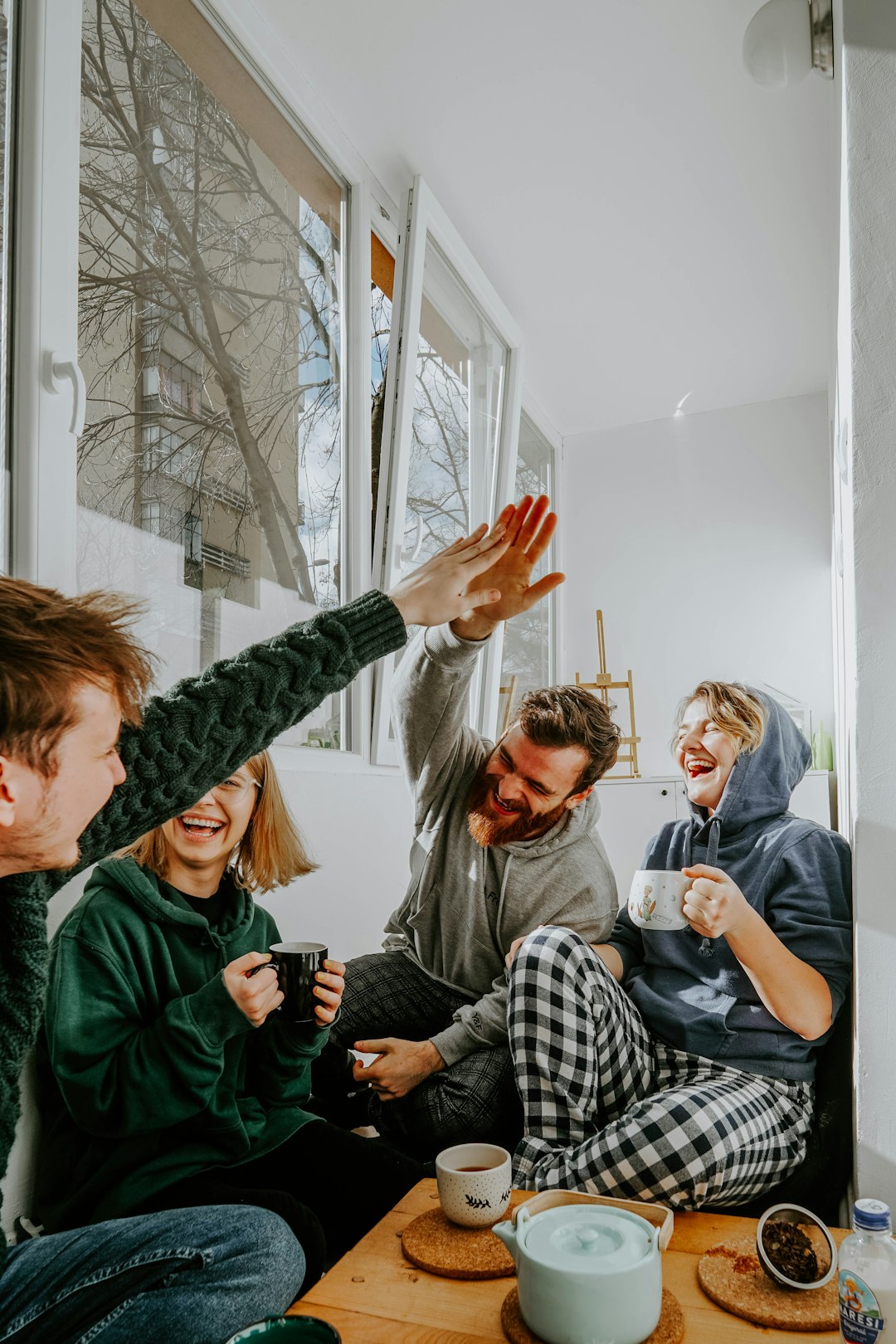 Friends laughing together over coffee